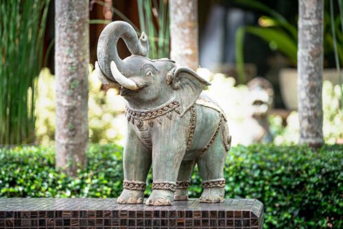 green ceramic elephant sculpture