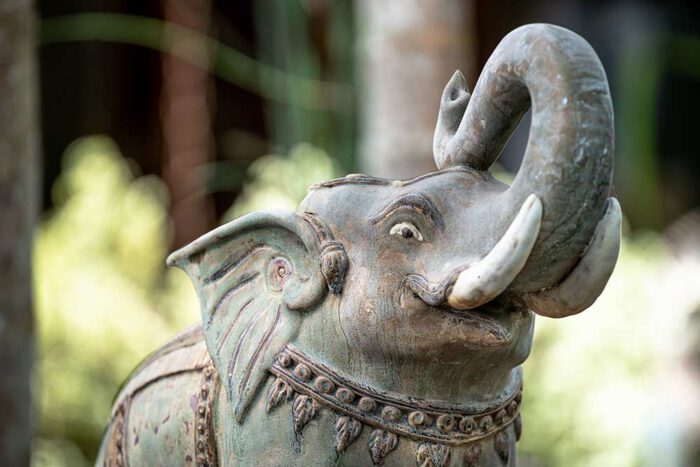 green ceramic elephant sculpture